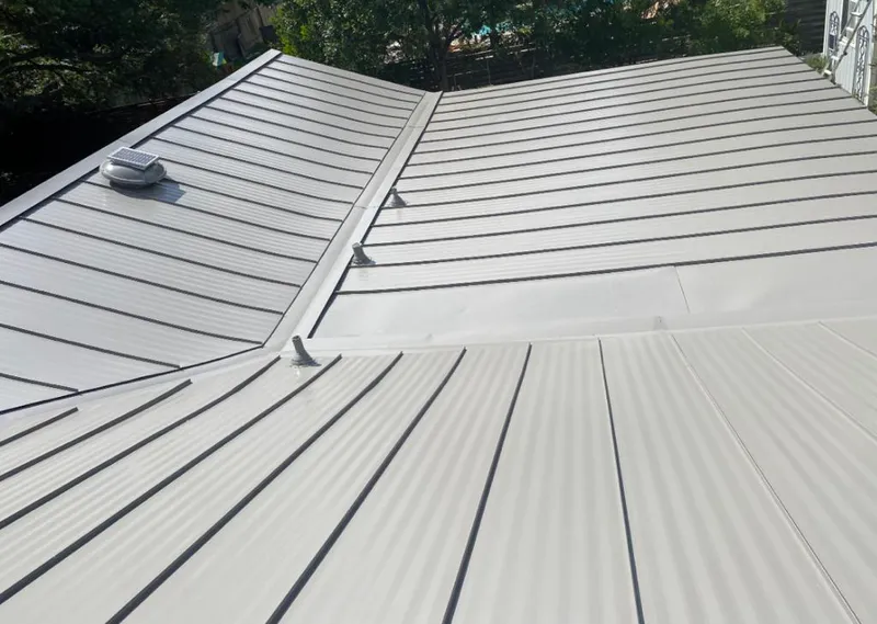 Solar attic fan installed on a metal roof for Roof Ventilation in White Settlement